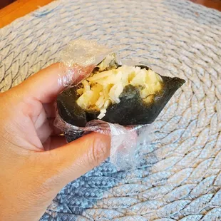 Vietnamese mochi dessert filled with shredded coconut and mung bean paste. It was delicious.