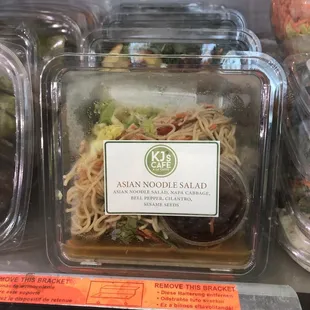 Asian noodle salad looks like it's about to leak? Condensation? Maybe it's the sauce? Idk