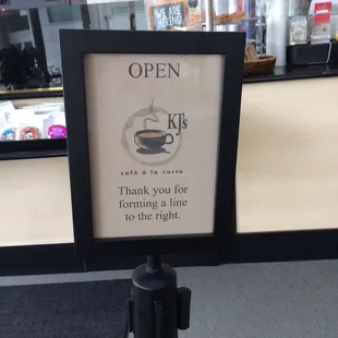 a sign in a coffee shop