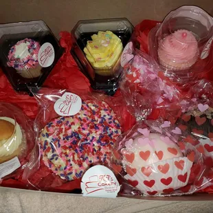 Variety of cupcakes and cocoa bombs.