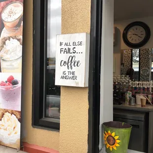  sign in the window of a coffee shop