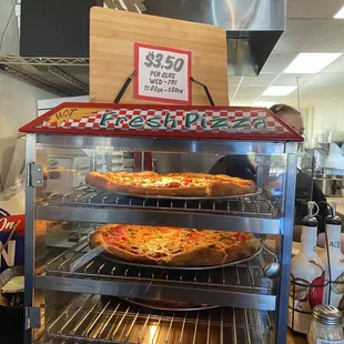 two pizzas in the oven