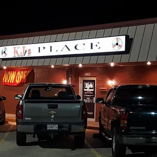 cars parked in front of the restaurant