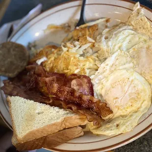 Over medium eggs, hash browns, bacon, sausage, toast