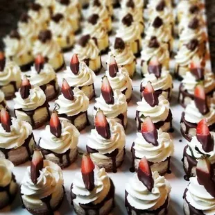 Our minis are great for all your event needs. Shown are our chocolate covered strawberry mini cheesecakes.