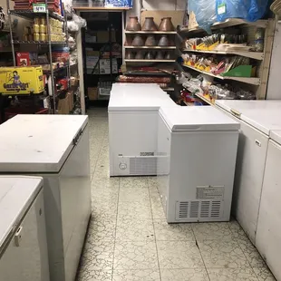 a row of refrigerators in a store