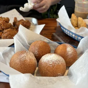 Cheese balls! Sweet exterior, cheesy interior. Texture of a cheesy donut. About the size of a small baseball - enough for leftovers.