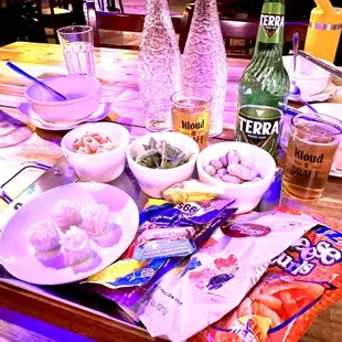 a table full of food and drinks