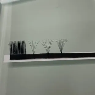 All of my fans are handmade by me. The number of extensions per fan depends on the strength of your natural eyelashes.