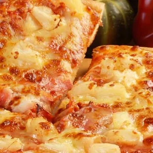 a closeup of a sliced pizza