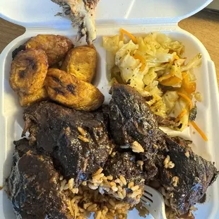 Jerk Chicken, Rice and beans, Cabbage, &amp; Plantains.