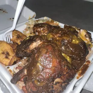Jerk chicken combo over red beans and rice with seasoned cabbage and plantains, STACKED enough for 2nds or to share