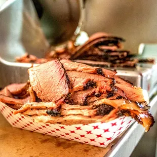 a roast beef sandwich in a basket