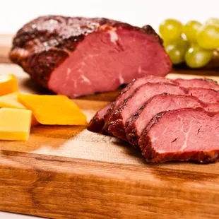 sliced meat and cheese on a cutting board