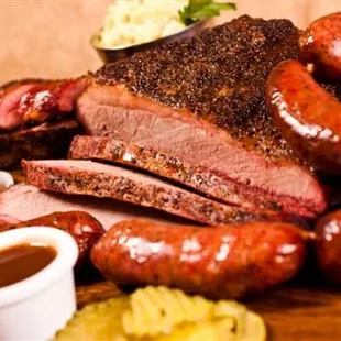 a platter of meat and sides