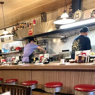 two men working in the kitchen