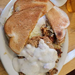 Country fried steak and eggs with rye toast.