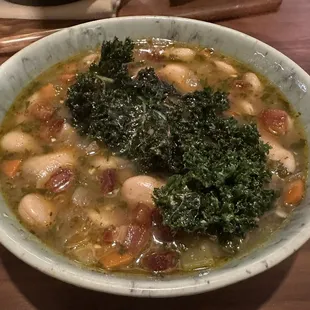 GIGANTE BEAN SOUP lemon, petite kale, calabrian oil, pancetta