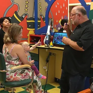 Watching Elmo while Grandpa blows bubbles