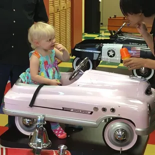 Sitting in one of the many fun seat choices!