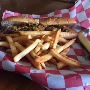 Philly steak sandwich and fries