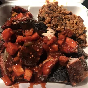 Pork ribs, tri-tip and a side of baked beans. Sauce on top. It all went into the trash after a few bites back at the hotel.
