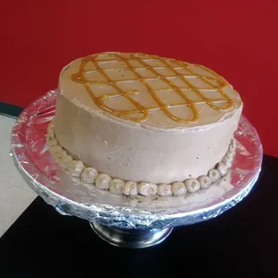 Chocolate cake with butter cream frosting. Caramel center and drizzle .