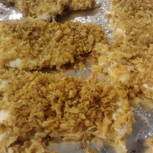 Fried onion crusted chicken breast .