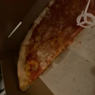 Raw cold pizza and the white is chopped raw onion that wasn&apos;t even cooked and thrown in as an afterthought even though I paid extra