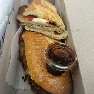 Fried Eggplant, fresh mozzarella, roasted red peppers hero and balsamic glaze on the side. On the menu as a wrap, subbed hero. YUM