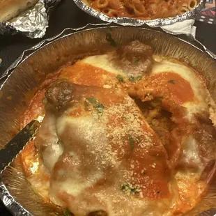 Veal parmigiana with pasta on a side