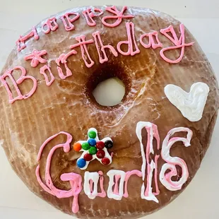 a frosted donut with pink icing