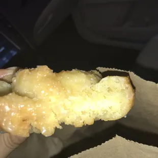 a hand holding a doughnut