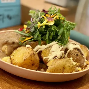 Rosemary Biscuits N Gravy- brown gravy, smashed potatoes, creme fraiche and arugula. So very good!