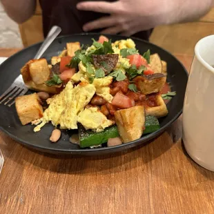 RANCHEROS BELGIAN WAFFLE, PINTO BEANS, SQUASH, CRISPY 15 POTATOES, RED OR GREEN CHILE, EGG, PICKLED RED ONION, AND TOMATO, CILANTRO