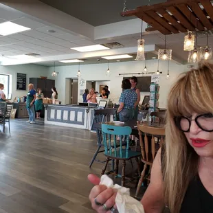 a woman eating a donut