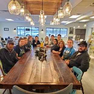 a group of people sitting around a table
