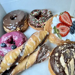 Chocolate Kronut, chocolate sprinkle donut, blueberry , tiger tail, strawberry kronut and S'mores Kronut