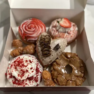 Clockwise from top L: guava cream cheese, strawberry cheesecake, salted caramel, red velvet and tiramisu at the center