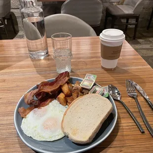 Eggs to order, sourdough toast, bacon and potatoes.