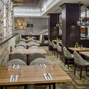 a dining area with tables and chairs