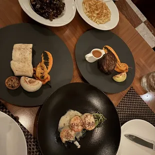 Scallops (amazing), halibut (great), filet (VERY dry), Brussels sprouts (good), Mac n cheese (avoid at all costs)