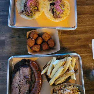 Tacos. Mac n cheese bites. Brisket. Sausage. Fries.  Street corn.