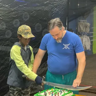 Cutting a birthday cake with a real sword!!!