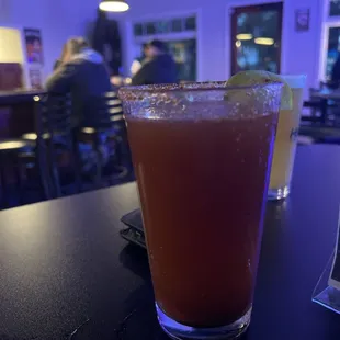 a drink in a glass on a table