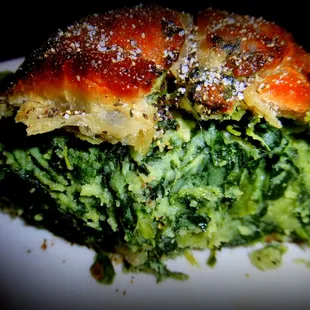 A peek inside the generously filled spinach knish