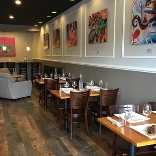 a dining area with tables and chairs