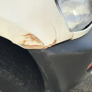 This shows the orange paint from the wall, on the car.
