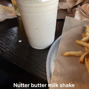 Nutter butter milk shake in front and strawberry milk shake in the back