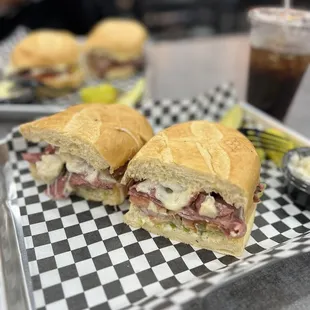 two sandwiches on a checkered tray